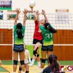 St. John's Knight Tylee Shepherd tips as Islanders Kiana Rivera and Valerie Escalona contests. (Photo by Michael Blas)