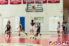 St. John's Knight Yasmeen Lopez sinks in a three pointer midway into the first quarter. (Photo by Michael Blas)