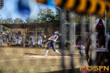 Academy Cougars Giana Sablan cracks one outfield for a single base hit. ( photo by Bout It Productions )