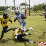 The Cowboys Logan Hatcher attempts to sneak away near the endzone from the Eagles John Mayo and Jeofry Limtiaco. (photo by Bout It Productions)