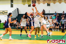 JFK Islanders Frencine Vilena and Kiyoni Yamaguchi blocks Academy's Myka Terlaje. (Photo by Michael Blas)
