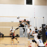 Tiyan Titan Xander Duenas powers the ball across the net to the Okkodo Bulldogs. Photo by Bout It Productions.