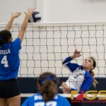 Norte Dame Royal's Ella Balajadia denies a shot from St. Paul Christian Warrior's Monica Giger. (Photo by Michael Blas)