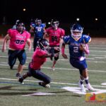 Guam High Panthers QB scrambles and takes the ball to the sidelines for the first down. (Photo by Michael Blas)