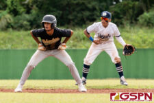 JFK Islander Allen Blend gets set for a run for third as ND Royal Dominic Cruz sets up to make a play. (Photo by Michael Blas)
