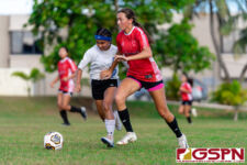 St. John's Knight Kaia Malakooti and ND Royal Michala Connelley fight for the ball. (Photo by Michael Blas)