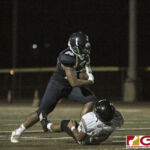 Guam High Panthers Izaak Castro powers through The Islanders defense for positive yards. (photo by Bout It Productions)