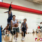 St. Paul Warriors Noah Hernandez steps past the Hawks defense for two points in the paint. (Photo by Michael Blas)