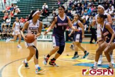 Academy Cougar Oriana Sevilla runs the play in the third quarter of the game. (Photo by Michael Blas)