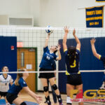 Harvest Eagles Aya Cathey connects with a spike while Guam High Panthers Alexia Brown and Ashton Quichocho attempt to block. (Photo by Michael Blas)