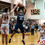 FD Friars Matt Fergurgur connects with a block on St. Paul Warriors Reo Aiken. (Photo by Michael Blas)