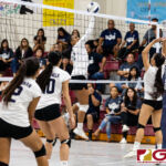 Academy Cougar Joycelyn Tenai punches the ball over to keep the volley alive. (Photo by Michael Blas)