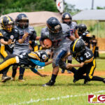 Bronco RB Logan Salinas spins off two Steeler defenders to gain extra yards on the play. (Photo by Michael Blas)