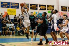 Guam High Panther Damien Dela Cruz grabs the offensive rebound and takes a shot at the basket. (Photo by Michael Blas)