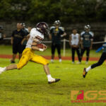 Player of the Game Kein Artero blazes through the holes of the JFK Islanders defense. (Photo By Michael Blas)