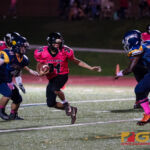 Southern High Dolphins Cerilo Reyes looks to run by the Guam High Panthers defense. (Photo by Michael Blas)