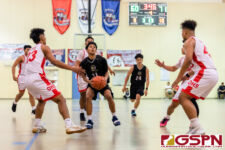 JFK Islander Rodson Simina gets through the Okkodo Bulldog defense for two points. (Photo by Michael Blas)