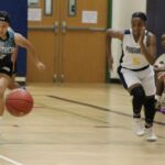 Panther Katrina Davis and Dolphin Jaden Perez break out in a foot race for a loose ball. (photo by Robert Balajadia)