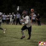 Okkodo Bulldogs Conan Baza scrambles with the pigskin while looking for an opening. (photo by Bout It Productions)