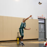Jfk Islander Ronnie Cruz delivers an overhead serve to the Tiyan Titans. Photo by Bout It Productions