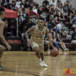 Team Elite's Jon Michael Lorena looks to get by Team Supreme's defenders. (photo by Bout It Productions)