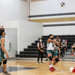 Jfk Islander Rileey Cruz connects with the ball against the Tiyan Titans. Photo by Bout It Productions