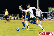 JFK Islander John Halili brings the ball downfield early on into the first half. (Photo by Michael Blas)