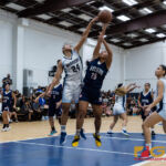 St. Paul Warriors Niah Siguenza gets a huge block on Okkodo Bulldogs Danica Cabrera. (Photo by Michael Blas)