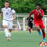 Guam Matao Defender Shawn Nicklaw and Maldives Forward Ibrahim Mahudhee chase down the ball. (Photo by Michael Blas)