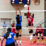 St. John's Knights Hallie Wigsten connects with a huge spike near the end of the second set. (Photo by Michael Blas)