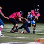 Southern High Dolphins Gabriel Stanley with a powerful stiff arm to Guam High Panthers Drew Mestas. (Photo by Michael Blas)