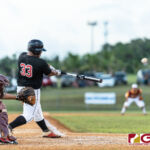 Simon Sanchez Sharks Jadein Evangelista connects with a big hit to bring in runners. (Photo by Michael Blas)