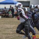 Team Legacy's Olivia Elliot powers her way through the Island Stunnerz defense. (photo by Bout It Productions)