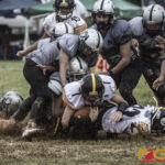 Tamuning Steelers Josiah Nauta powers through the Guam Raiders defense. (photo by Bout It Productions)