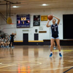 St. Paul Warriors Janniliese Quintanilla knocks in a shot at the free throw line. (Photo by Michael Blas)