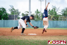 Guam's Z. Panes makes it to first base before New Zealand's Rodney Komene can get to him. (Photo by Michael Blas)