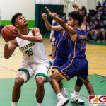 JFK Islanders Lawrence Tisalong aims for the basket after snatching the offensive rebound. (Photo by Michael Blas)