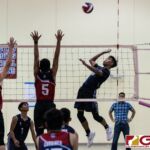 St. Paul Warriors Isaiah Macalma loads up for a kill while Okkodo Bulldogs Aydan Abad and Nash Espino go up to contests. (Photo by Michael Blas)