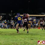 FD Friars Javian Cruz attempts a reception in the first half of the opening IIAAG High School Football game. (Photo by Michael Blas)