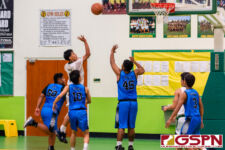 JFK Islander Rodson Simina sinks in two points in the third quarter of the game. (Photo by Michael Blas)