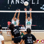 Tiyan Titan Khloe Owen sends the ball over Islanders Hannah Hular, left, and Kamalynne Lizama, right. (Photo by Michael Blas)