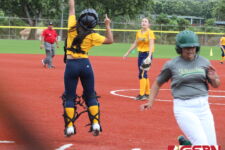 An errant throw home brings in a run for the JFK Islanders in the 2nd inning. (photo by Robert Balajadia)