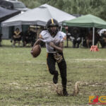 Tamuning Steelers Bryant Ignacio carries the ball after the opening kickoff. (photo by Bout It Productions)
