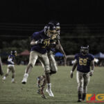 GW Geckos Brendyn Cruz goes up for the bump after adding points to the board. (photo by Bout It Productions)