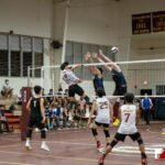 FD Friar Jeremiah Nguyen powers the ball past two Harvest Eagles defenders. ( Photo by Bout It Productions )