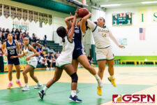 Academy Cougar Aluna Hernandez draws a foul in the paint in the first quarter. (Photo by Michael Blas)