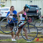 New mommy Mieko Carey gets some cheers from her infant twins in the transition from bike to run Sunday morning during the sprint series triathlon hosted by the Guam National Triathlon Federation. (Photo by Michael Blas)