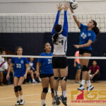 Norte Dame Royal's Austia Mendiola spikes past St. Paul Christian Warrior's Niah Siguenza. (Photo by Michael Blas)