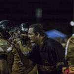 JFK Islanders Coach Brian Hahn gets in the face of Chase Spotanski on the sidelines. (photo by Michael Ebio)