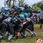 Guam Packers Jaython DeJesus finds himself surrounded by the Angels defense. (photo by Bout It Productions)